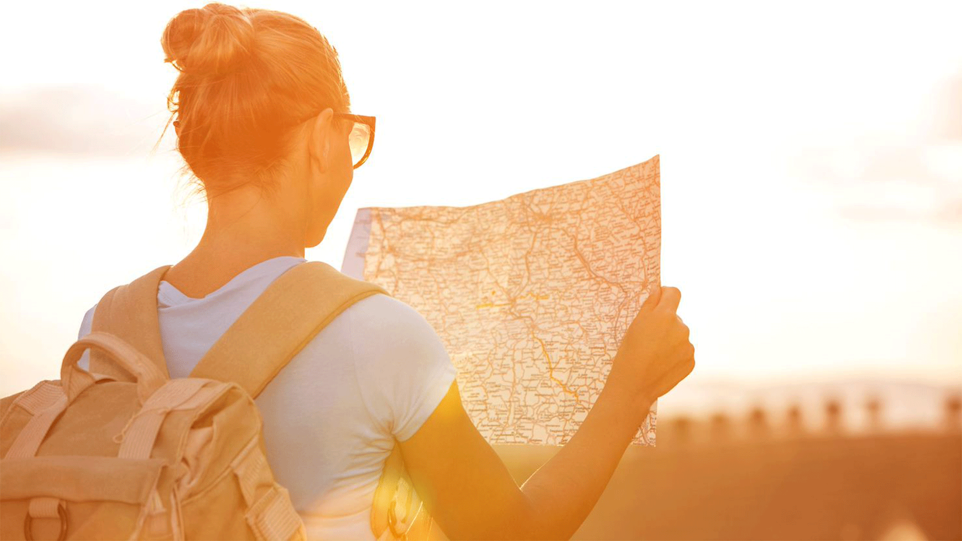 itinerary-map-woman-backpack-sunset