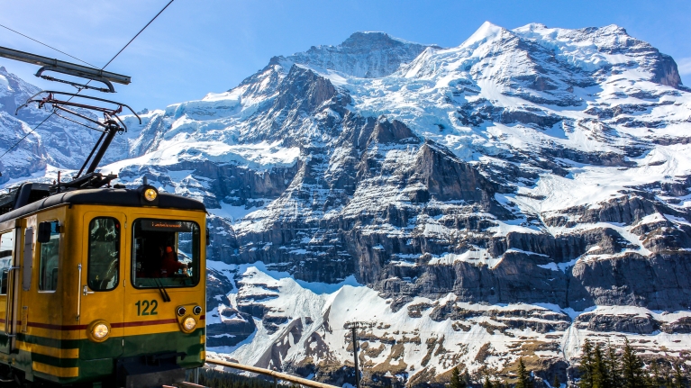 switzerland-jungfraujoch-yellow-train-mountain-snow