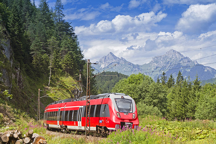 austria-train-through-mountain-landscape