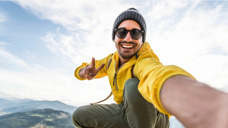 Man taking a selfie while hiking