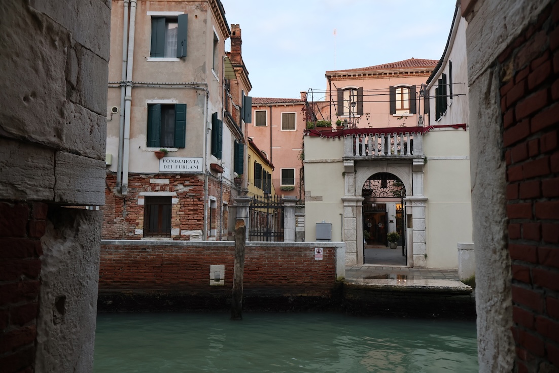 A quiet canal with old buildings in Venice